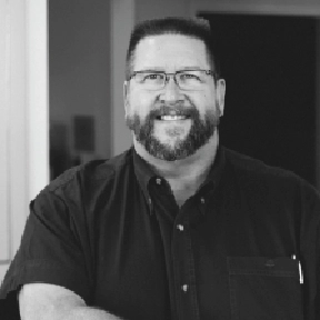 Portrait of Dr. John H. Paul, DMD smiling warmly.